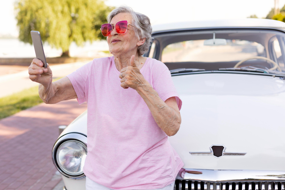 happy senior woman standing her car