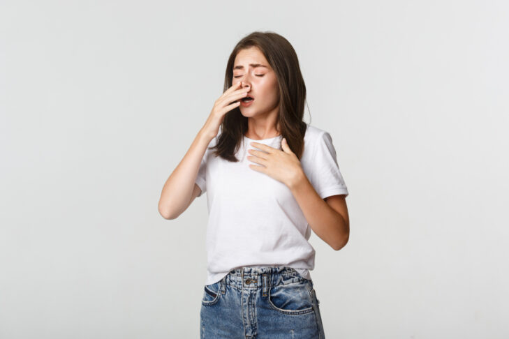 young woman with allergy sneezing girl feeling sick having runny nose