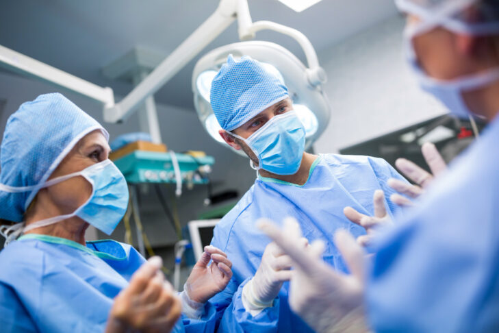 surgeons interacting with each other operation room
