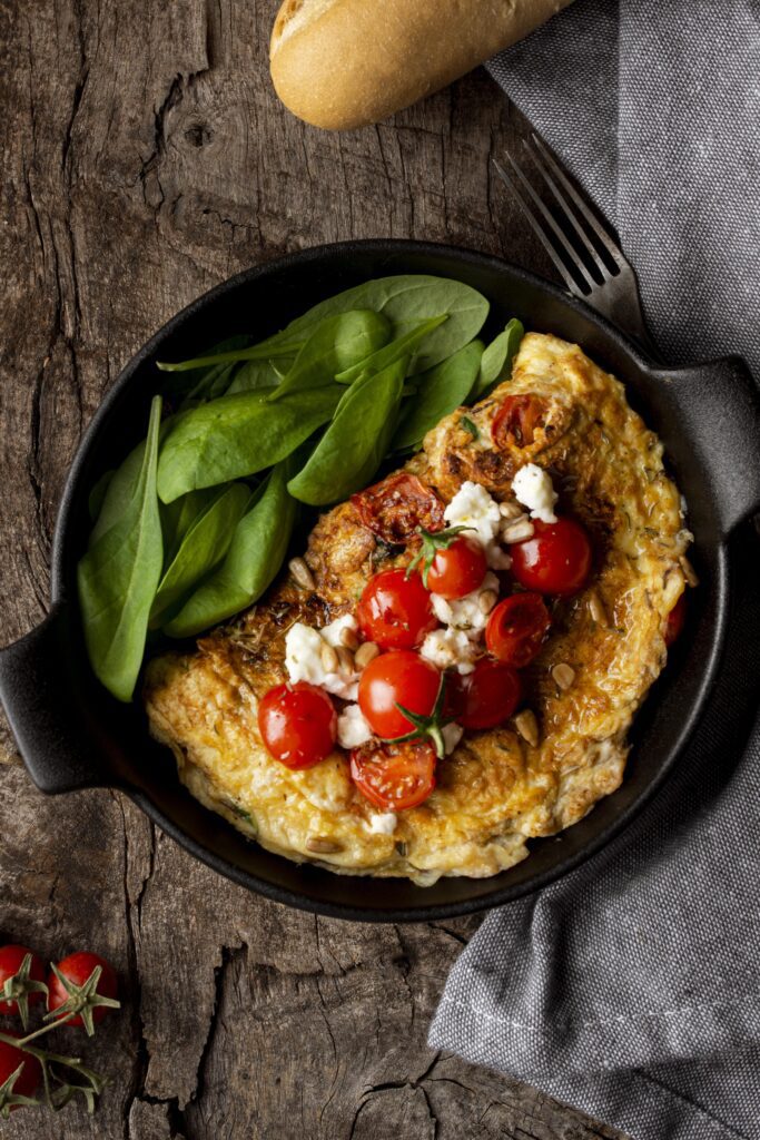 top view omelette with cherry tomatoes