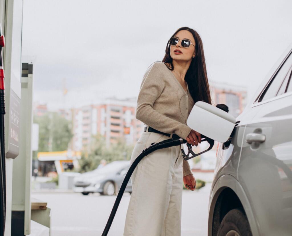 young woman fueling her car e1766924455883